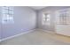 Clean bedroom featuring neutral walls, carpet, and window coverings at 7453 E 26Th Ave # 2, Denver, CO 80238