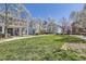 Well manicured community lawn with flowering trees in a multi-home neighborhood at 7453 E 26Th Ave # 2, Denver, CO 80238