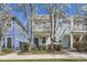 Delightful light blue two-story home featuring a quaint porch and inviting curb appeal at 7453 E 26Th Ave # 2, Denver, CO 80238
