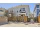 Two story townhome with street lamp and fenced yard at 7453 E 26Th Ave # 2, Denver, CO 80238
