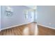 Bright living area with hardwood floors, multiple windows, and neutral walls at 7453 E 26Th Ave # 2, Denver, CO 80238