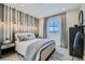 Tastefully decorated bedroom with a comfortable bed, stylish lighting, and modern accents at 6877 Bryant Ct, Denver, CO 80221