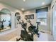 Bright exercise room featuring workout equipment, large mirror, and window with natural light for a healthy lifestyle at 6877 Bryant Ct, Denver, CO 80221