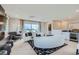 Relaxing living room space with wet bar, modern furnishings, and scenic views at 6877 Bryant Ct, Denver, CO 80221
