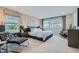 Comfortable main bedroom with accent wall, windows, and stylish furnishings for a relaxing retreat at 6877 Bryant Ct, Denver, CO 80221