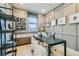 Cozy home office with built-in storage, a modern desk, and stylish wall decor at 6877 Bryant Ct, Denver, CO 80221