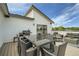 Spacious outdoor patio perfect for entertaining with an outdoor dining set and lounge furniture at 6877 Bryant Ct, Denver, CO 80221