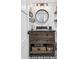Rustic bathroom with dark vanity, woven baskets, and decorative elements at 7152 E Hinsdale Pl, Centennial, CO 80112
