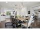 Spacious dining room adjacent to the kitchen, featuring hardwood floors and classic furnishings at 7152 E Hinsdale Pl, Centennial, CO 80112