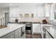 Bright kitchen with stainless steel appliances and a subway tile backsplash at 7152 E Hinsdale Pl, Centennial, CO 80112