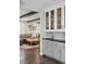 Wet bar view leading to a cozy living room with comfortable seating and decor at 7152 E Hinsdale Pl, Centennial, CO 80112