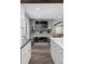 Bright living room features a brick fireplace, modern floors and open floorplan at 7152 E Hinsdale Pl, Centennial, CO 80112