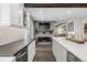 Open floor plan living room features brick fireplace, hardwood floors and sleek design at 7152 E Hinsdale Pl, Centennial, CO 80112