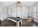 Brightly lit room features a Pilates machine and ample natural light from the windows, making it a workout haven at 7152 E Hinsdale Pl, Centennial, CO 80112
