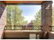 Outdoor deck with iron railing, views of the neighborhood, and brick columns at 907 E 22Nd Ave, Denver, CO 80205