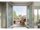 Inviting outdoor balcony with wicker furniture offering beautiful treetop views at 907 E 22Nd Ave, Denver, CO 80205