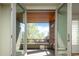 View from inside to the covered outdoor deck, a perfect extension of living space at 907 E 22Nd Ave, Denver, CO 80205