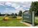 A view of the Denver City Park sign, lush landscaping, and a statue of in the background at 907 E 22Nd Ave, Denver, CO 80205