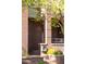 View of home exterior showing the address number, landscaping, and brick detail at 907 E 22Nd Ave, Denver, CO 80205