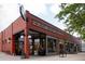This charming storefront features 'Fine Meats, Seafood, Fresh Produce' in bold lettering and large storefront windows at 907 E 22Nd Ave, Denver, CO 80205