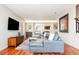 Cozy living area with a plush sofa, hardwood floors, and modern decor at 907 E 22Nd Ave, Denver, CO 80205