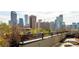 Rooftop view of the city featuring a metal railing and surrounding buildings at 907 E 22Nd Ave, Denver, CO 80205