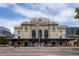 Historic Denver Union Station featuring its iconic facade, blue umbrellas, and bustling pedestrian activity at 907 E 22Nd Ave, Denver, CO 80205