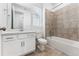 Bathroom with white vanity, tile flooring, and shower-tub combination at 16478 W 92Nd Pl, Arvada, CO 80007