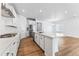 Contemporary kitchen featuring an island with a breakfast bar, and stainless steel appliances at 16478 W 92Nd Pl, Arvada, CO 80007