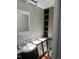 Bathroom featuring a white vanity, white countertops, and cabinet for storage at 819 27Th St, Denver, CO 80205