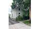 Charming two-story home with lush landscaping and architectural details, near a sidewalk and alleyway at 819 27Th St, Denver, CO 80205