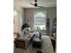 Living room with gray couch, ceiling fan, and lots of natural light at 819 27Th St, Denver, CO 80205