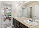Bathroom with double vanity that connects to a bedroom at 24356 E Powers Ave, Aurora, CO 80016