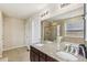 Neutral toned bathroom featuring double sinks with granite countertop and updated lighting at 24356 E Powers Ave, Aurora, CO 80016