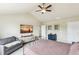 Bedroom with vaulted ceiling, plush carpet, large windows, and TV at 24356 E Powers Ave, Aurora, CO 80016