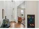 Entryway with hardwood floors and a view into a colorful playroom at 24356 E Powers Ave, Aurora, CO 80016