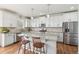 Modern kitchen featuring granite countertops, stainless steel appliances, and a cozy breakfast bar at 24356 E Powers Ave, Aurora, CO 80016