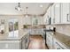 Bright kitchen featuring granite countertops, stainless steel appliances, and wood floors at 24356 E Powers Ave, Aurora, CO 80016