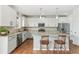 Modern kitchen featuring granite countertops, stainless steel appliances, and a cozy breakfast bar at 24356 E Powers Ave, Aurora, CO 80016