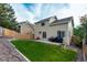 The landscaped backyard offers a private patio area, ideal for relaxing or grilling at 5972 S Zante Way, Aurora, CO 80015