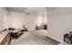 Spacious basement area with neutral carpet and a contemporary coffee table for flexible living space at 5972 S Zante Way, Aurora, CO 80015