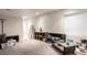 Cozy basement featuring neutral carpet, recessed lighting, and a modern coffee table at 5972 S Zante Way, Aurora, CO 80015