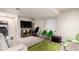 Finished basement with neutral walls, carpet, and a variety of seating options at 5972 S Zante Way, Aurora, CO 80015