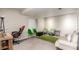 Finished basement with neutral walls, carpet, and a variety of seating options at 5972 S Zante Way, Aurora, CO 80015