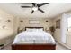 Bright bedroom with ceiling fan, large windows, and a cozy ambiance at 5972 S Zante Way, Aurora, CO 80015