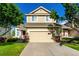 Charming two-story home with attached garage and inviting curb appeal on a sunny day at 5972 S Zante Way, Aurora, CO 80015
