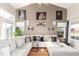 Comfortable living room with a large sectional sofa, hardwood floors, and stylish decor at 5972 S Zante Way, Aurora, CO 80015