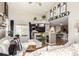 Inviting living room featuring a fireplace, high ceilings, and an open concept design at 5972 S Zante Way, Aurora, CO 80015