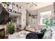 Bright and airy living room with a cozy sofa, fireplace, and open layout at 5972 S Zante Way, Aurora, CO 80015