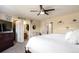 Bright main bedroom with ceiling fan, ensuite bath, and walk-in closet at 5972 S Zante Way, Aurora, CO 80015